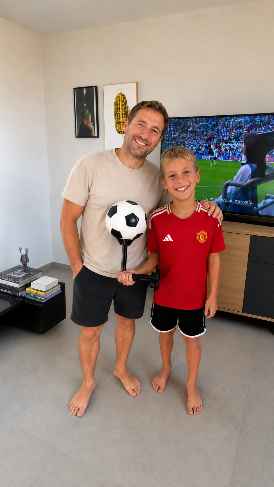 Dad and son smiling together with Kickpal at home